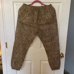 Cheetah print joggers with zipper detail pocket.